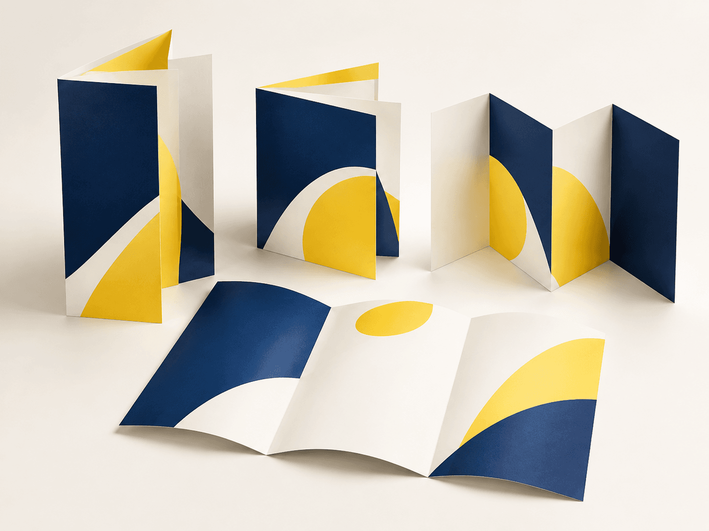 Illustration of brochures in several folded formats with navy and yellow cover designs